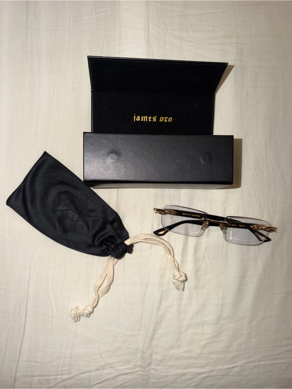 James Oro Rimless Rectangle Glasses in Black and Gold with Purple Tint